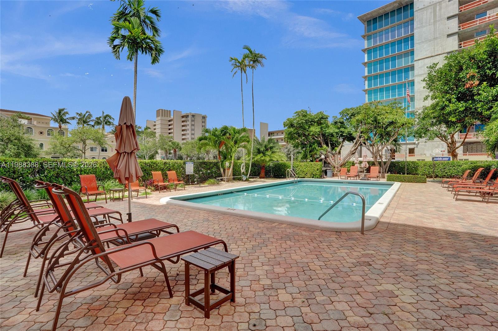 400 North Riverside Drive, Unit 214 Pompano Beach, FL 33062 - Photo 33 of 67 a view of a swimming pool with a lounge chairs