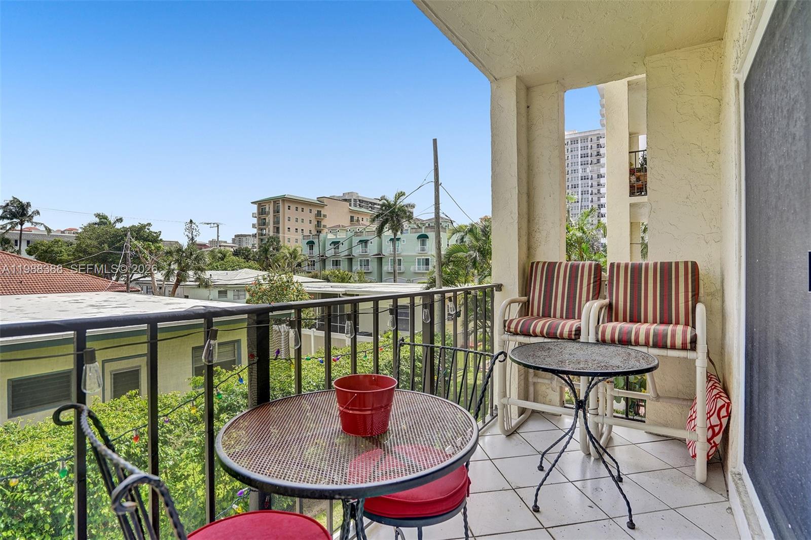 400 North Riverside Drive, Unit 214 Pompano Beach, FL 33062 - Photo 10 of 67 a view of a balcony with table and chairs