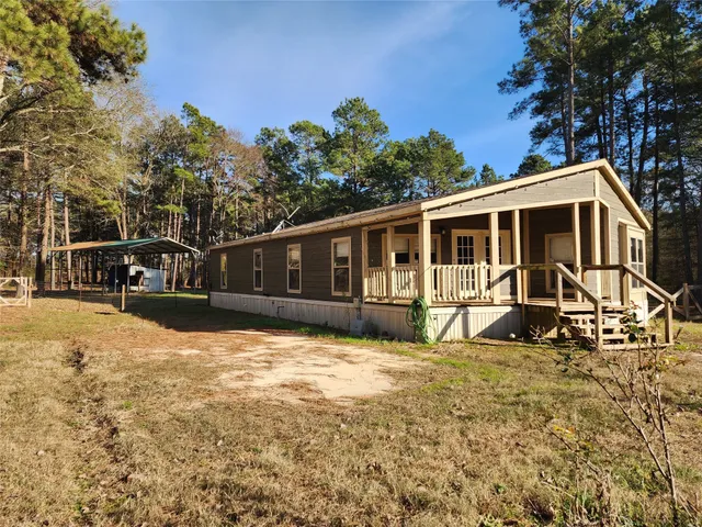 a front view of a house with a porch