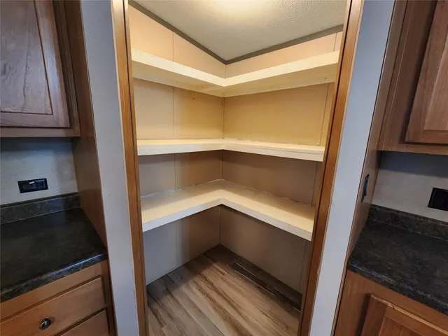 a hallway view with staircase