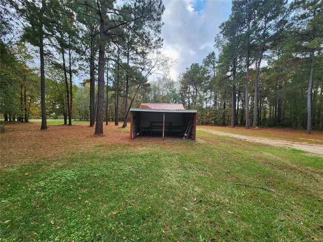 a backyard of a house with lots of green space