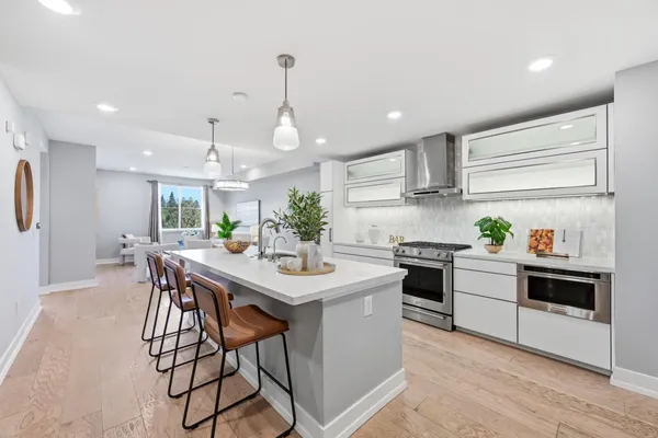 a kitchen with a table and chairs in it