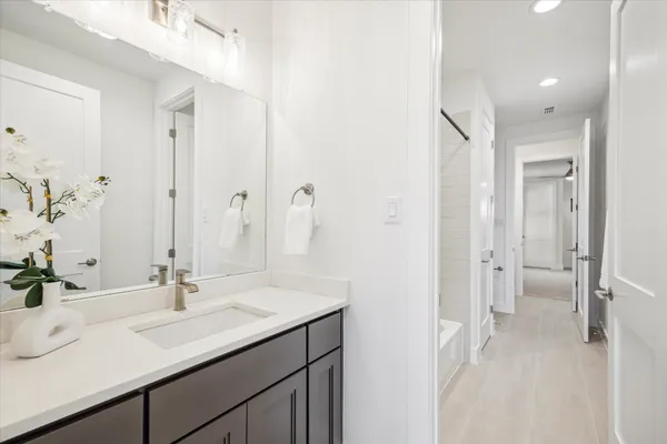 a bathroom with a sink double vanity and a mirror