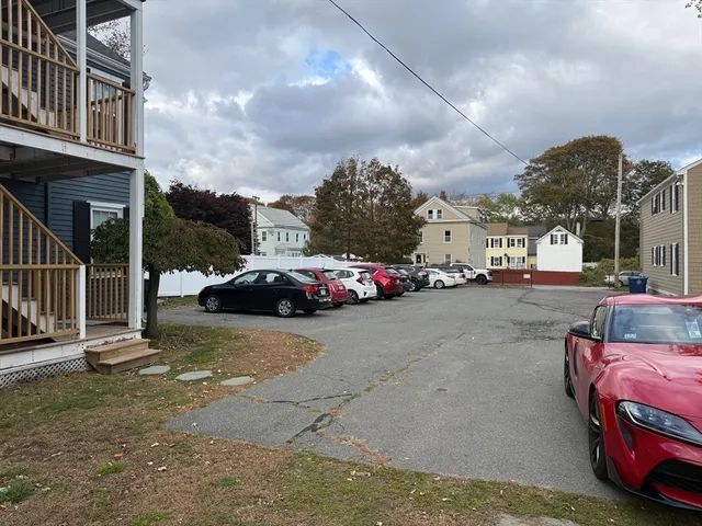 a view of a cars parked on the side of a street