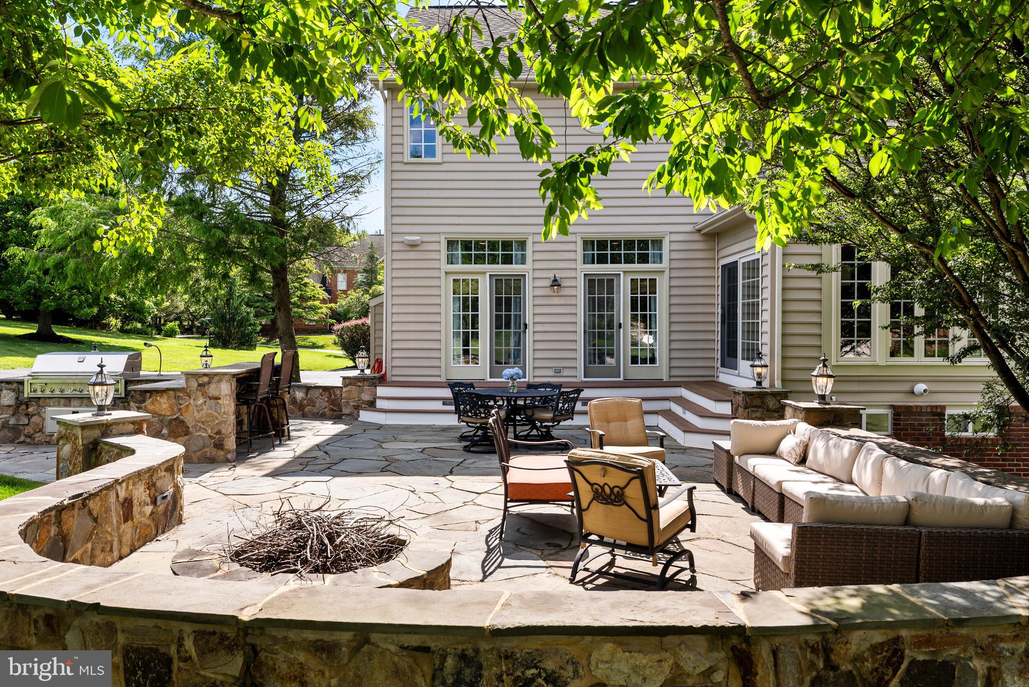 7 Redtree Lane Reisterstown, MD 21136 - Photo 54 of 56 a view of a patio with couches table and chairs and potted plants