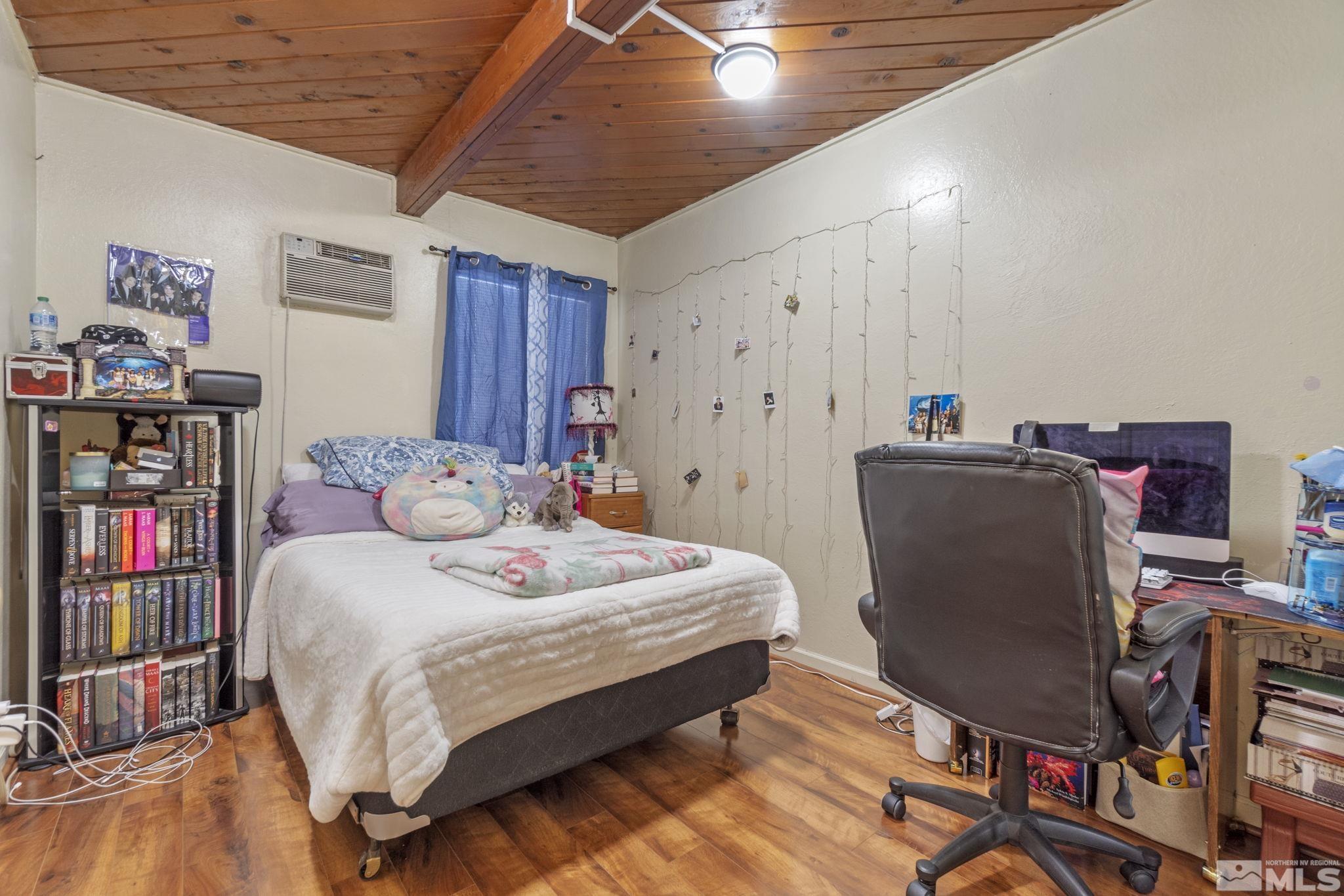1905 Citron Street Reno, NV 89512 - Photo 8 of 18 a bed room with a bed and a chair