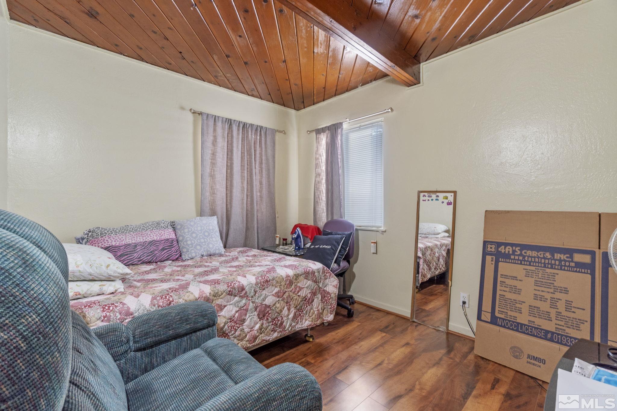 1905 Citron Street Reno, NV 89512 - Photo 9 of 18 a bedroom with a bed and a dresser