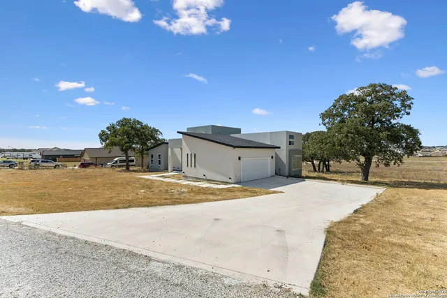 a view of a house with a snow in the yard