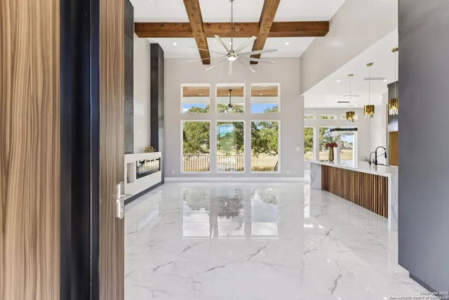 an empty room with window and entrance