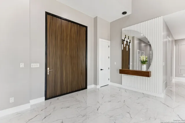 a kitchen with stainless steel appliances a refrigerator and a stove