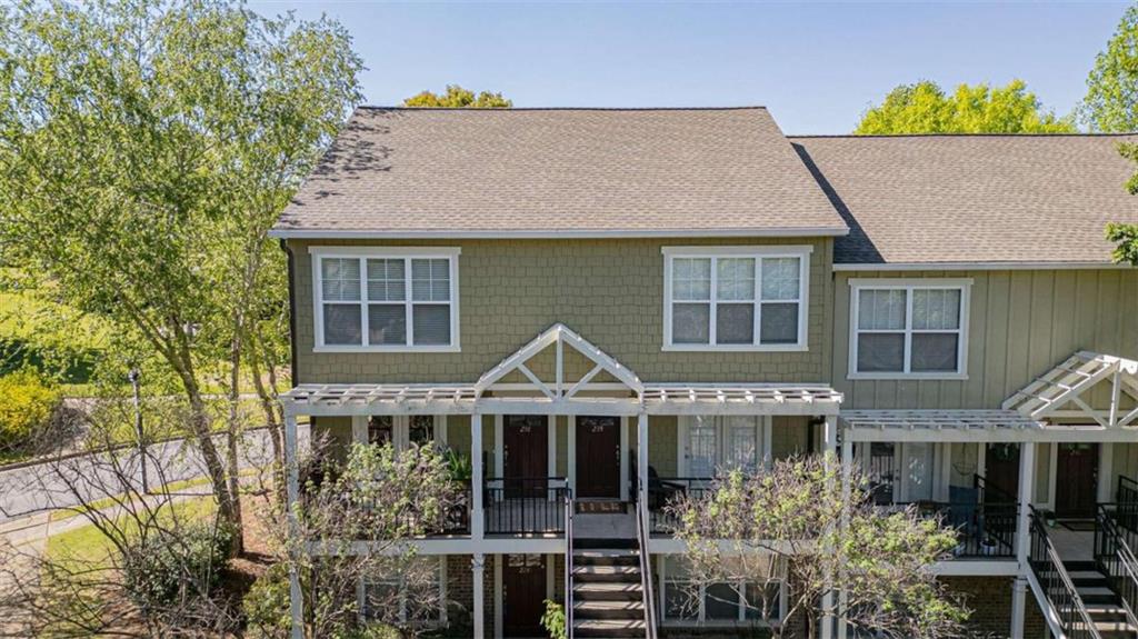 490 South Barnett Shoals Road, Unit 238 Athens, GA 30605 - Photo 1 of 1 a front view of a house with a yard and potted plants