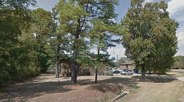 a view of a street with some trees