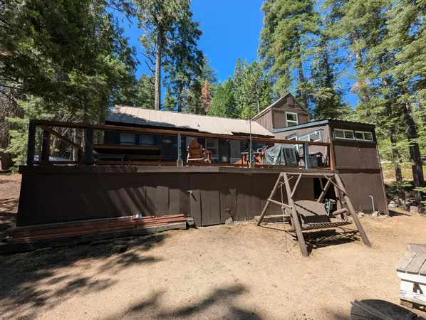 a view of a backyard with sitting area