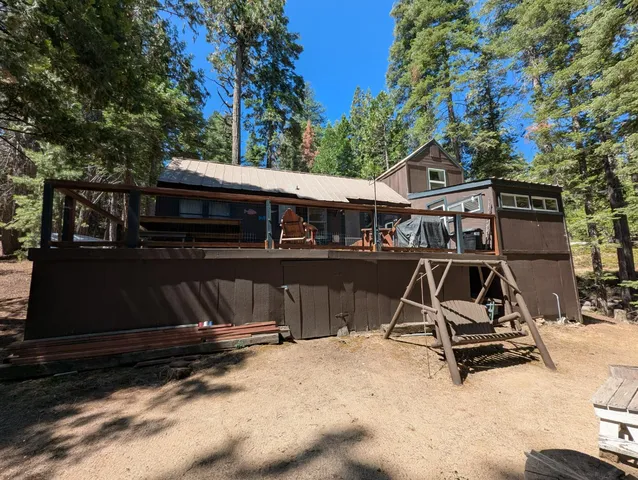 a view of a backyard with sitting area