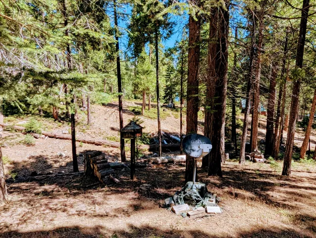 a balcony with wooden floor and outdoor seating
