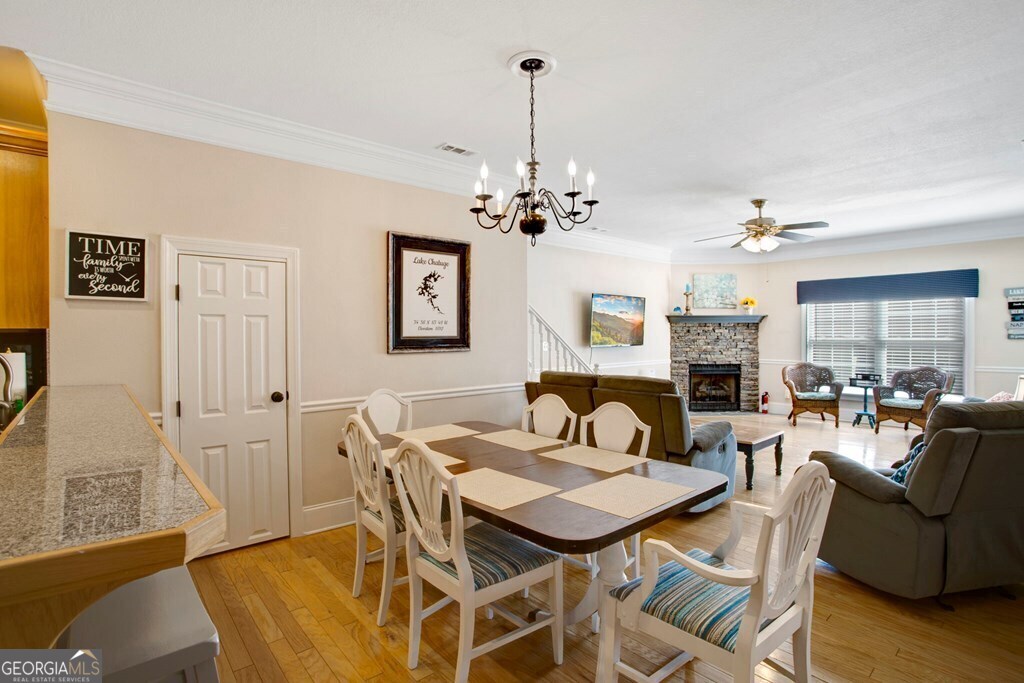 1725 Water Crest Way, Unit D Young Harris, GA 30582 - Photo 11 of 42 a view of a dining room with furniture and wooden floor