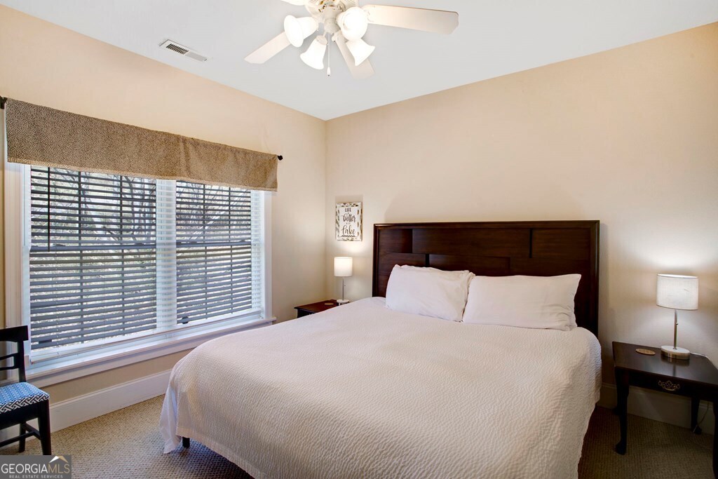 1725 Water Crest Way, Unit D Young Harris, GA 30582 - Photo 13 of 42 a bedroom with a large bed and a large window