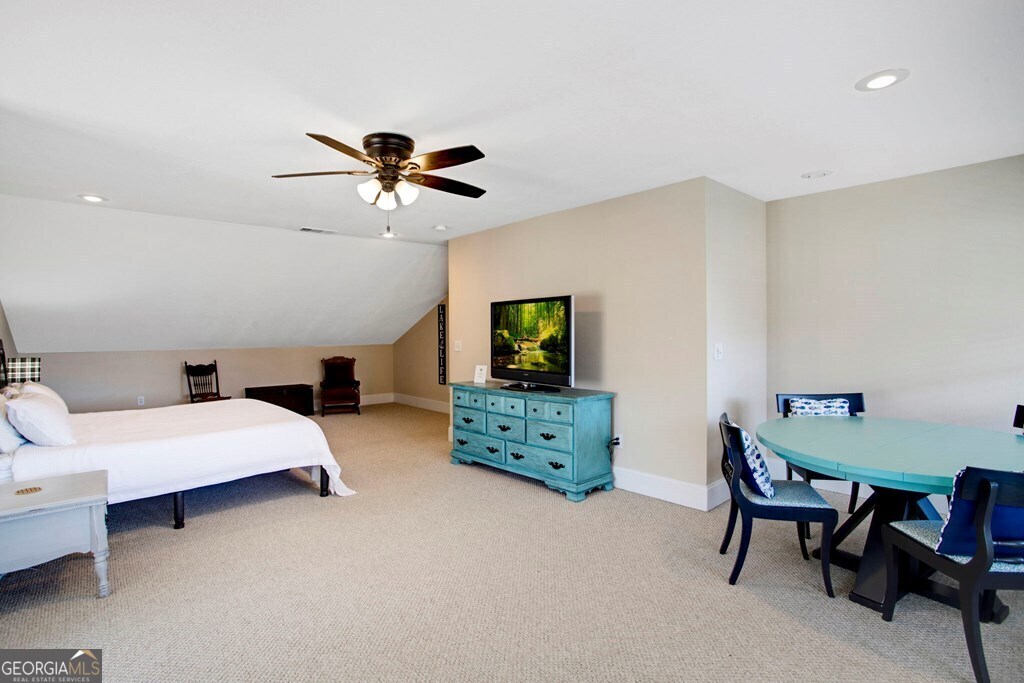 1725 Water Crest Way, Unit D Young Harris, GA 30582 - Photo 22 of 42 a bedroom with furniture and a chandelier