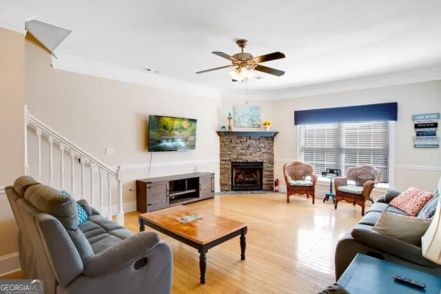 a living room with furniture fireplace and a flat screen tv