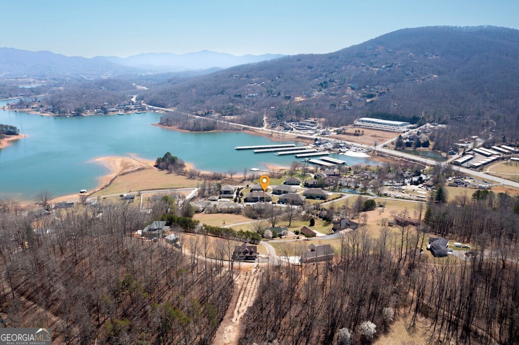 1725 Water Crest Way, Unit D Young Harris, GA 30582 - Photo 31 of 42 a view of a lake with a mountain