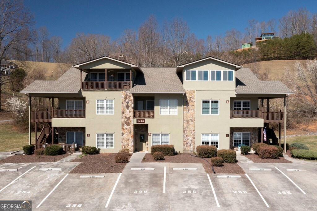 1725 Water Crest Way, Unit D Young Harris, GA 30582 - Photo 35 of 42 a front view of a house with a yard and garage
