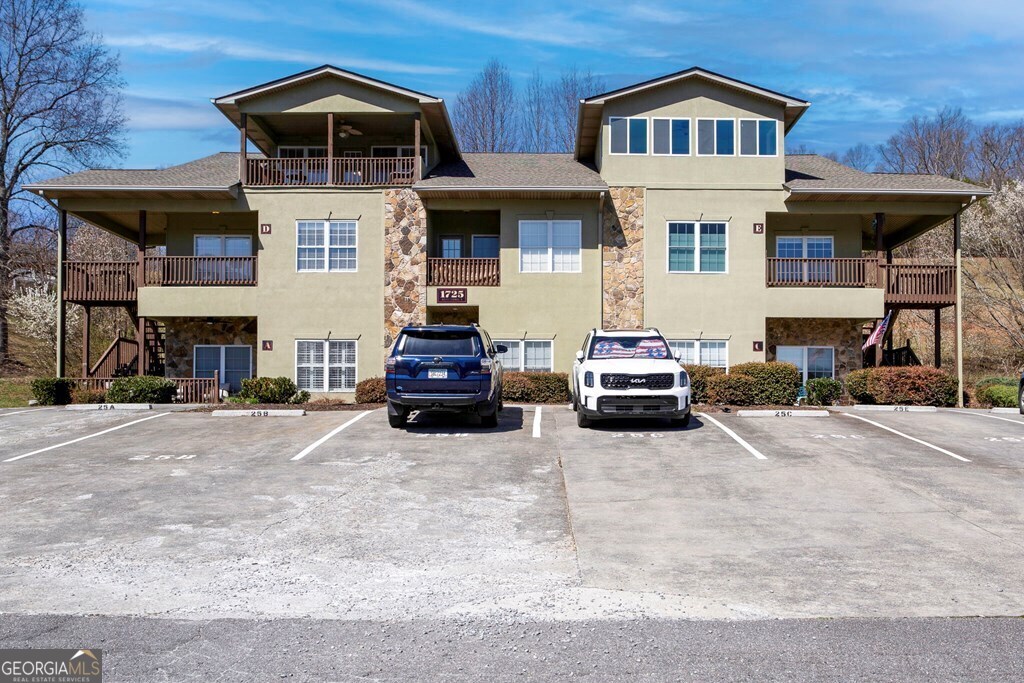 1725 Water Crest Way, Unit D Young Harris, GA 30582 - Photo 37 of 42 a car parked in front of a building