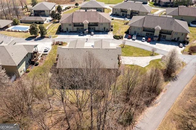 an aerial view of a house with lake view