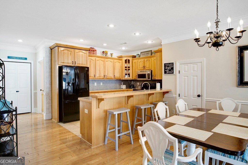 1725 Water Crest Way, Unit D Young Harris, GA 30582 - Photo 6 of 42 a living room with kitchen island granite countertop furniture a refrigerator and a dining table