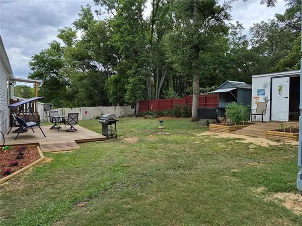 a view of a house with a back yard