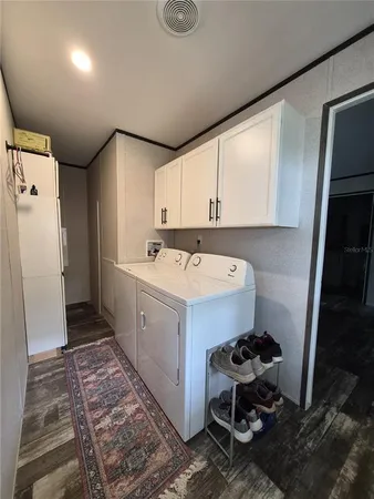 a utility room with a sink a washer and dryer