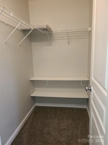 a view of an empty walk in closet