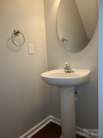 a bathroom with a sink a mirror and a toilet