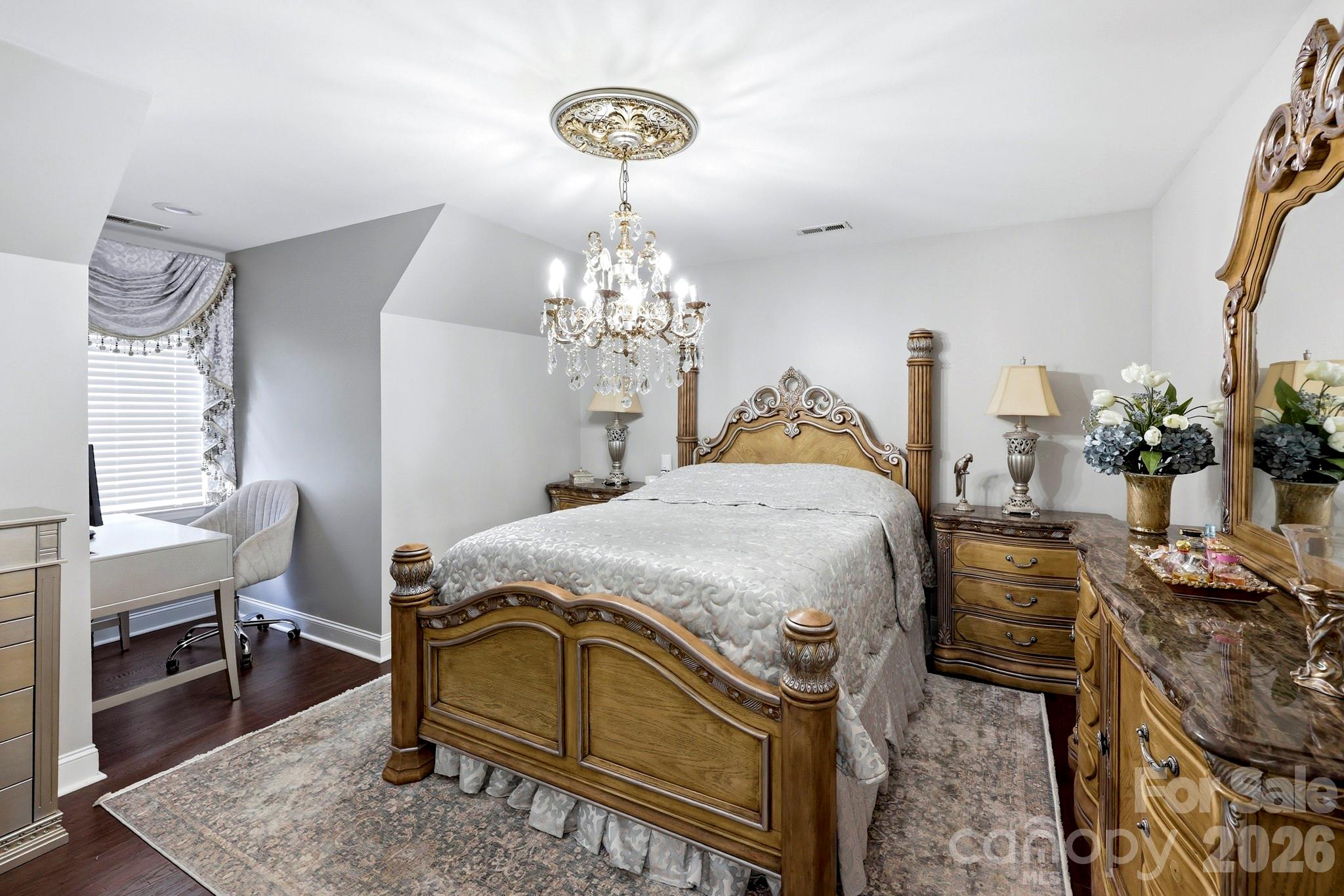 327 Sherry Street Rutherfordton, NC 28139 - Photo 14 of 22 a bedroom with a bed and a chandelier