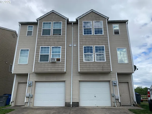 a view of a house with large windows