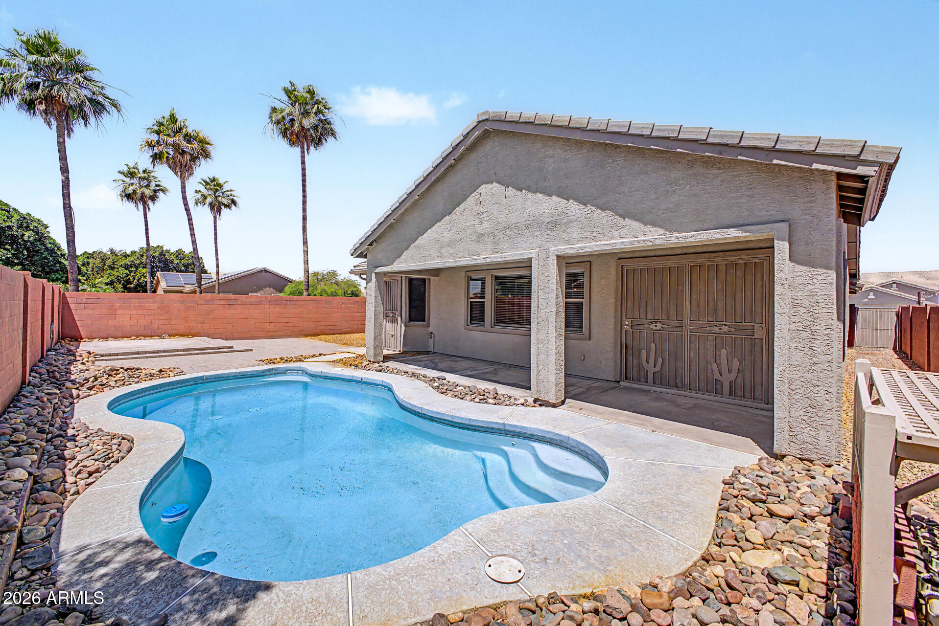 11199 West Monte Vista Road Avondale, AZ 85392 - Photo 32 of 36 a view of a house with a swimming pool