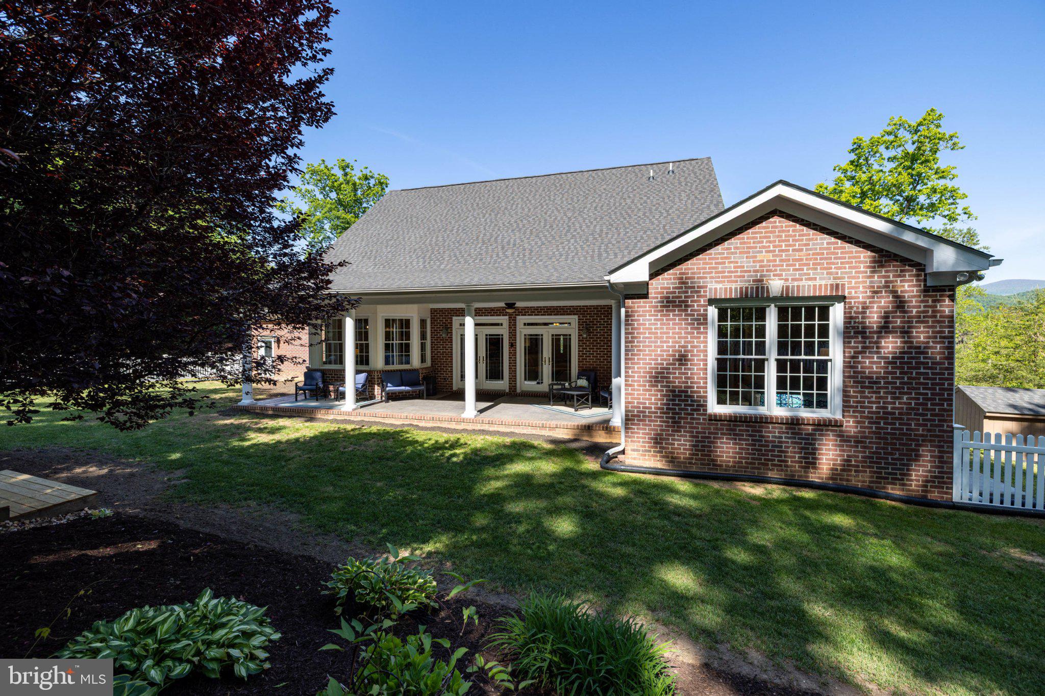 246 Lawsons Farm Circle Ruckersville, VA 22968 - Photo 101 of 130 a front view of a house with a yard and porch