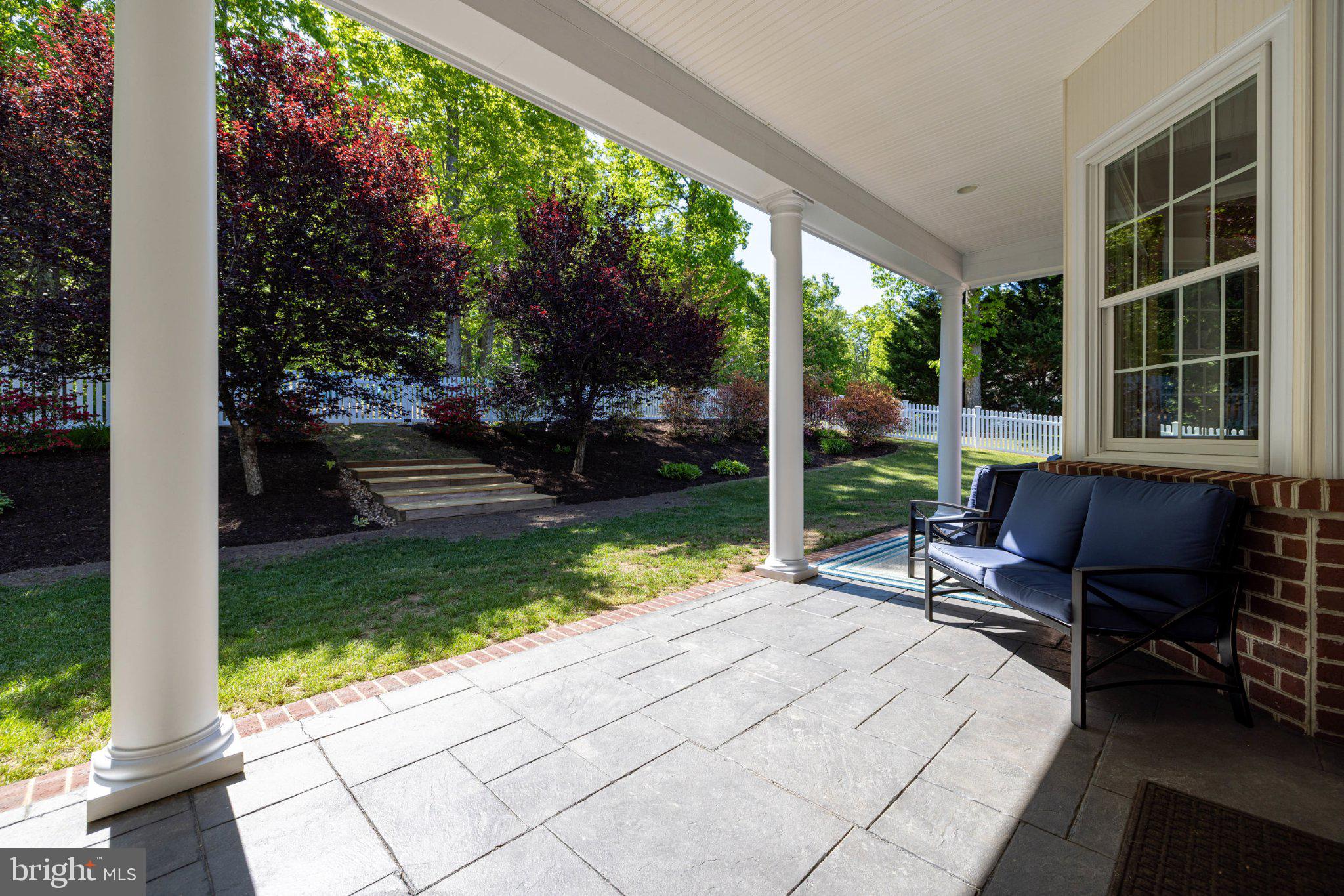246 Lawsons Farm Circle Ruckersville, VA 22968 - Photo 104 of 130 Charming porch with lush greenery.