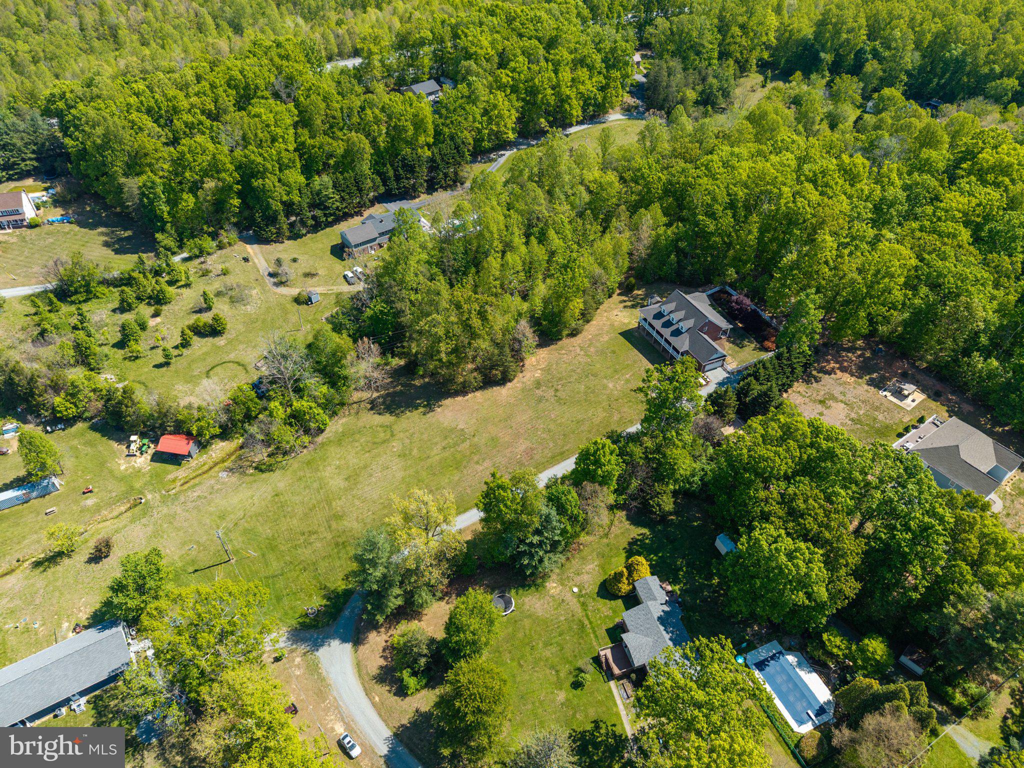 246 Lawsons Farm Circle Ruckersville, VA 22968 - Photo 117 of 130 Lush greenery surrounds serene homes.