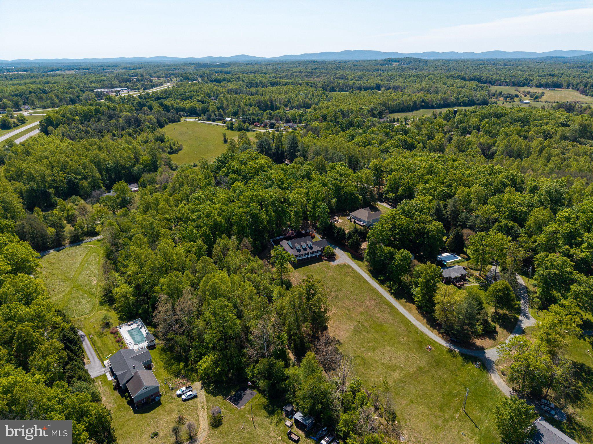 246 Lawsons Farm Circle Ruckersville, VA 22968 - Photo 125 of 130 a view of a city with lush green forest