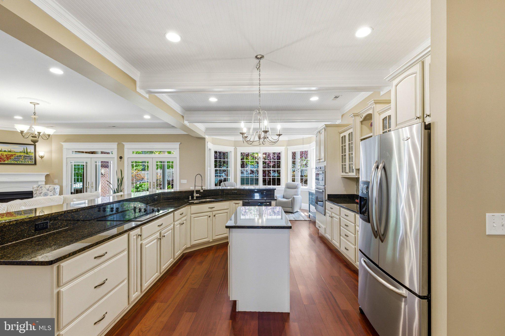 246 Lawsons Farm Circle Ruckersville, VA 22968 - Photo 17 of 130 a large kitchen with a large window and stainless steel appliances