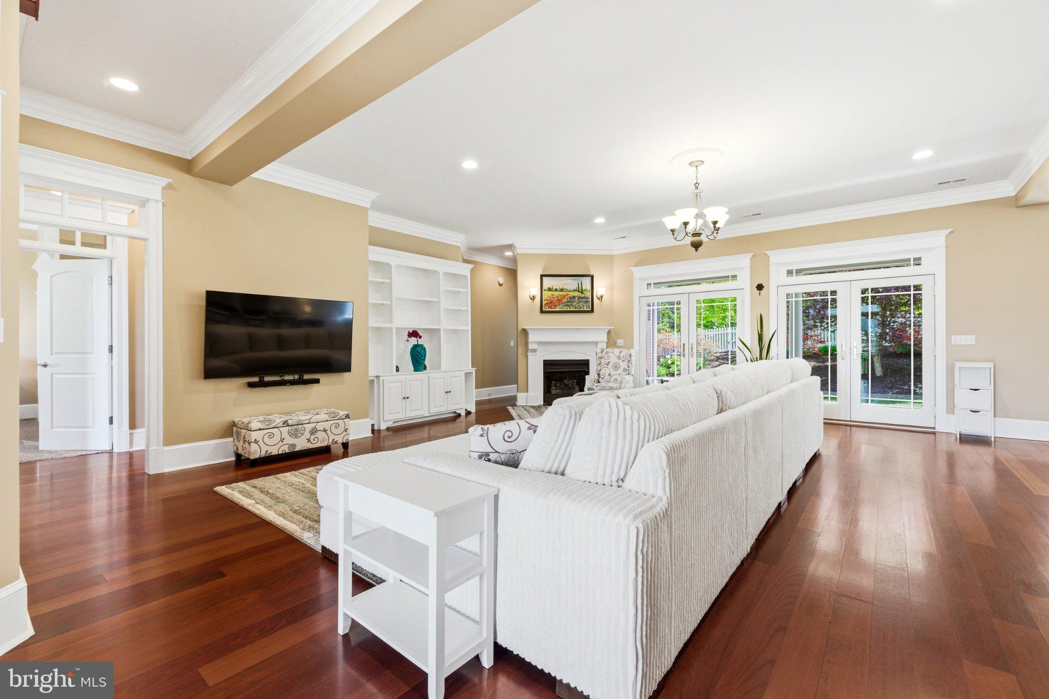 246 Lawsons Farm Circle Ruckersville, VA 22968 - Photo 27 of 130 a living room with furniture wooden floor and a flat screen tv