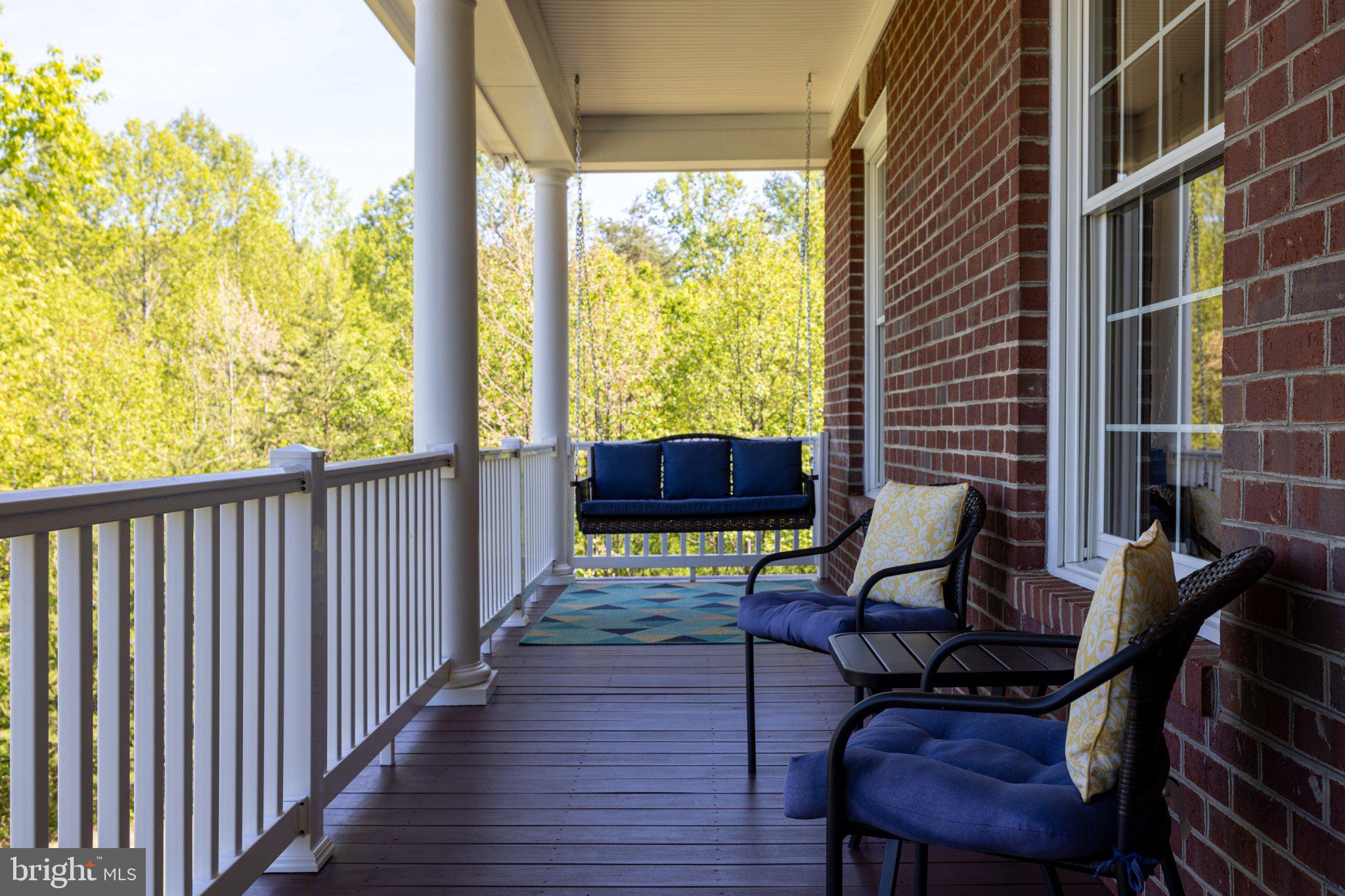246 Lawsons Farm Circle Ruckersville, VA 22968 - Photo 4 of 130 a view of balcony with wooden floor and outdoor seating