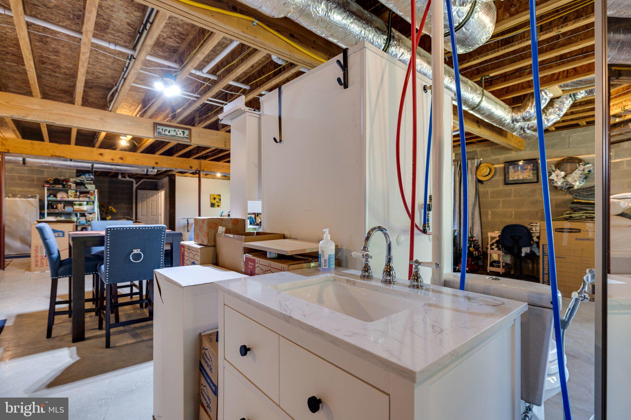 246 Lawsons Farm Circle Ruckersville, VA 22968 - Photo 58 of 130 Modern basement with utility features.