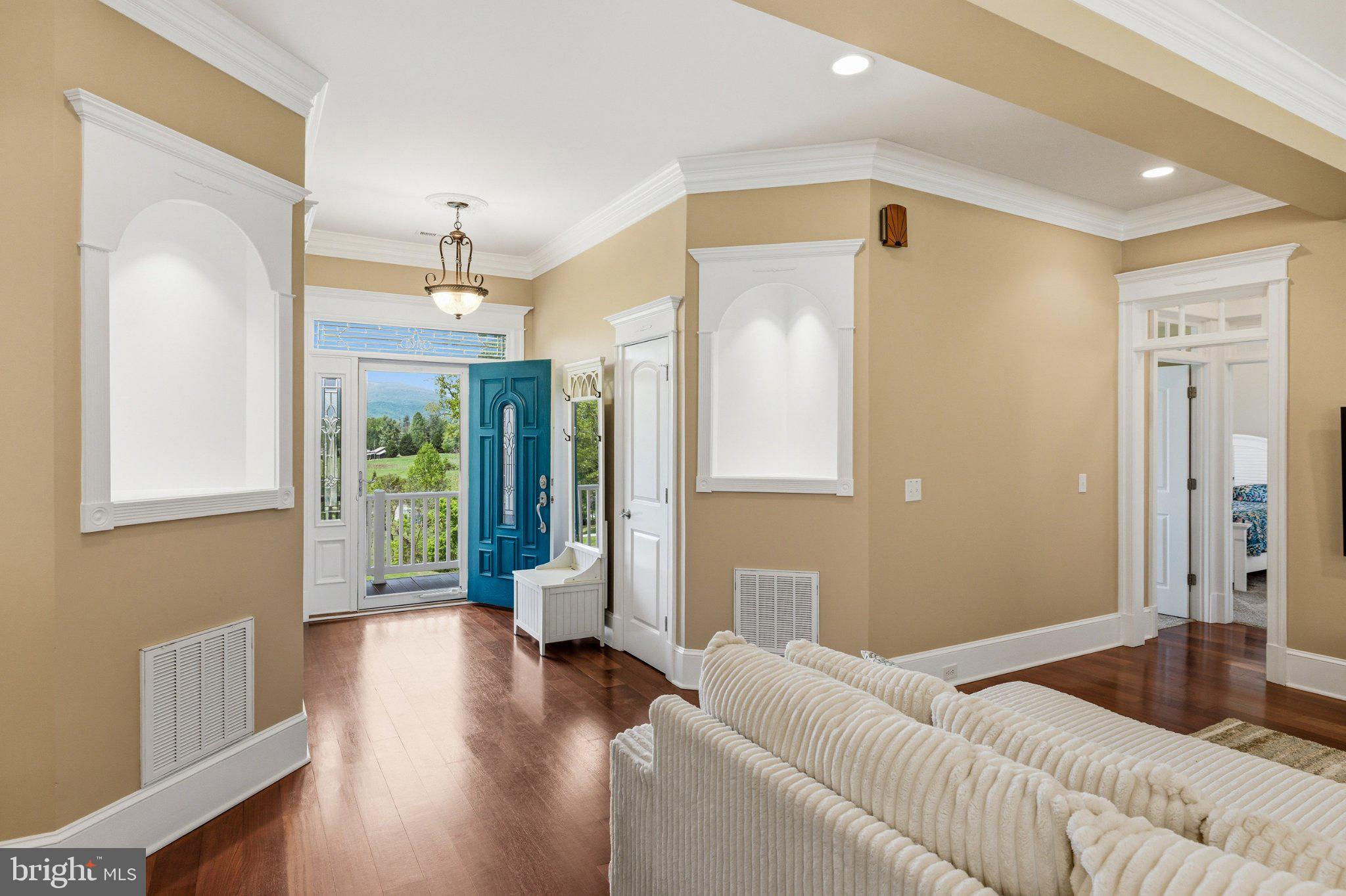 246 Lawsons Farm Circle Ruckersville, VA 22968 - Photo 7 of 130 a living room with furniture and a large window