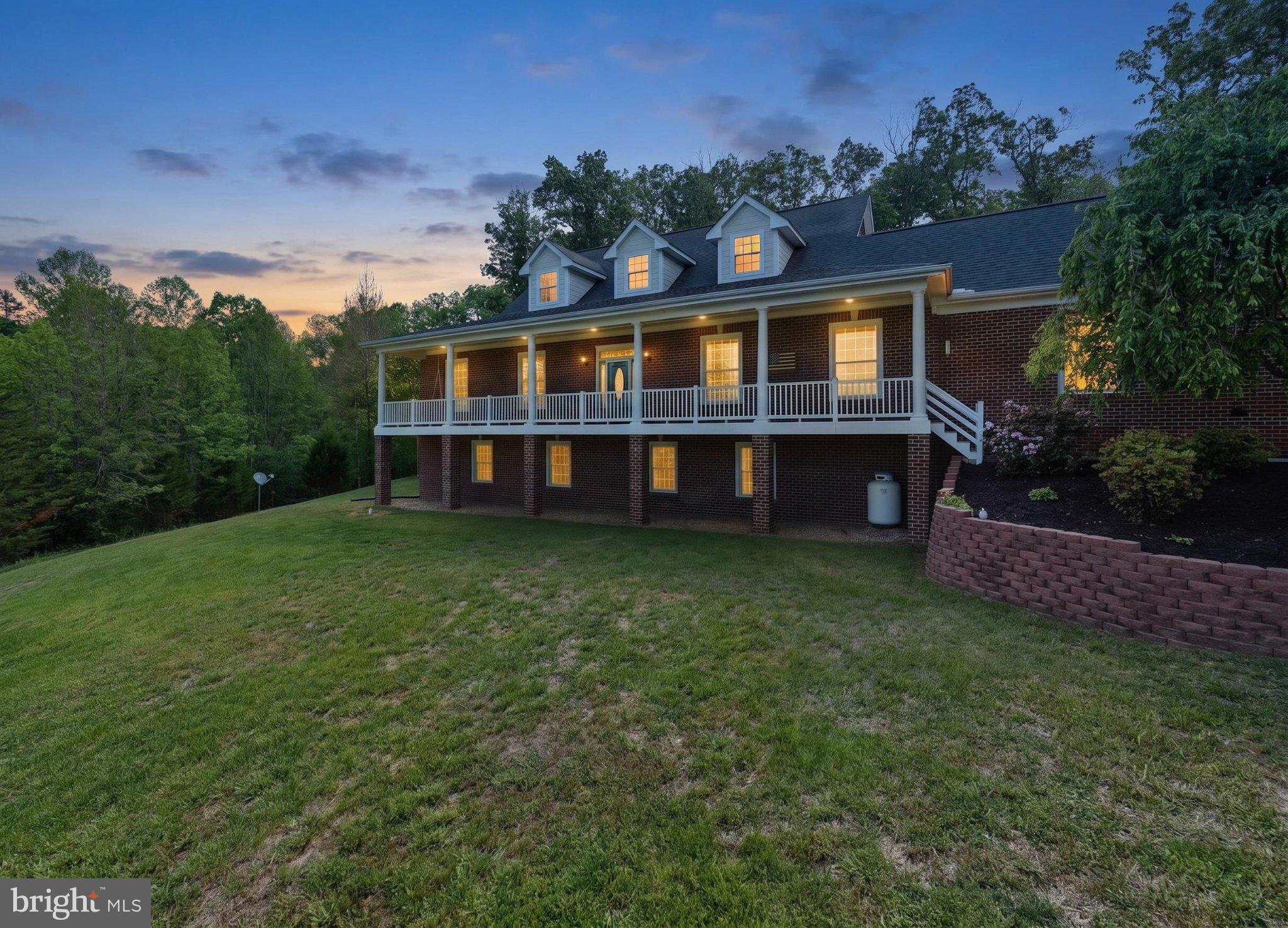 246 Lawsons Farm Circle Ruckersville, VA 22968 - Photo 71 of 130 a front view of a house with a garden