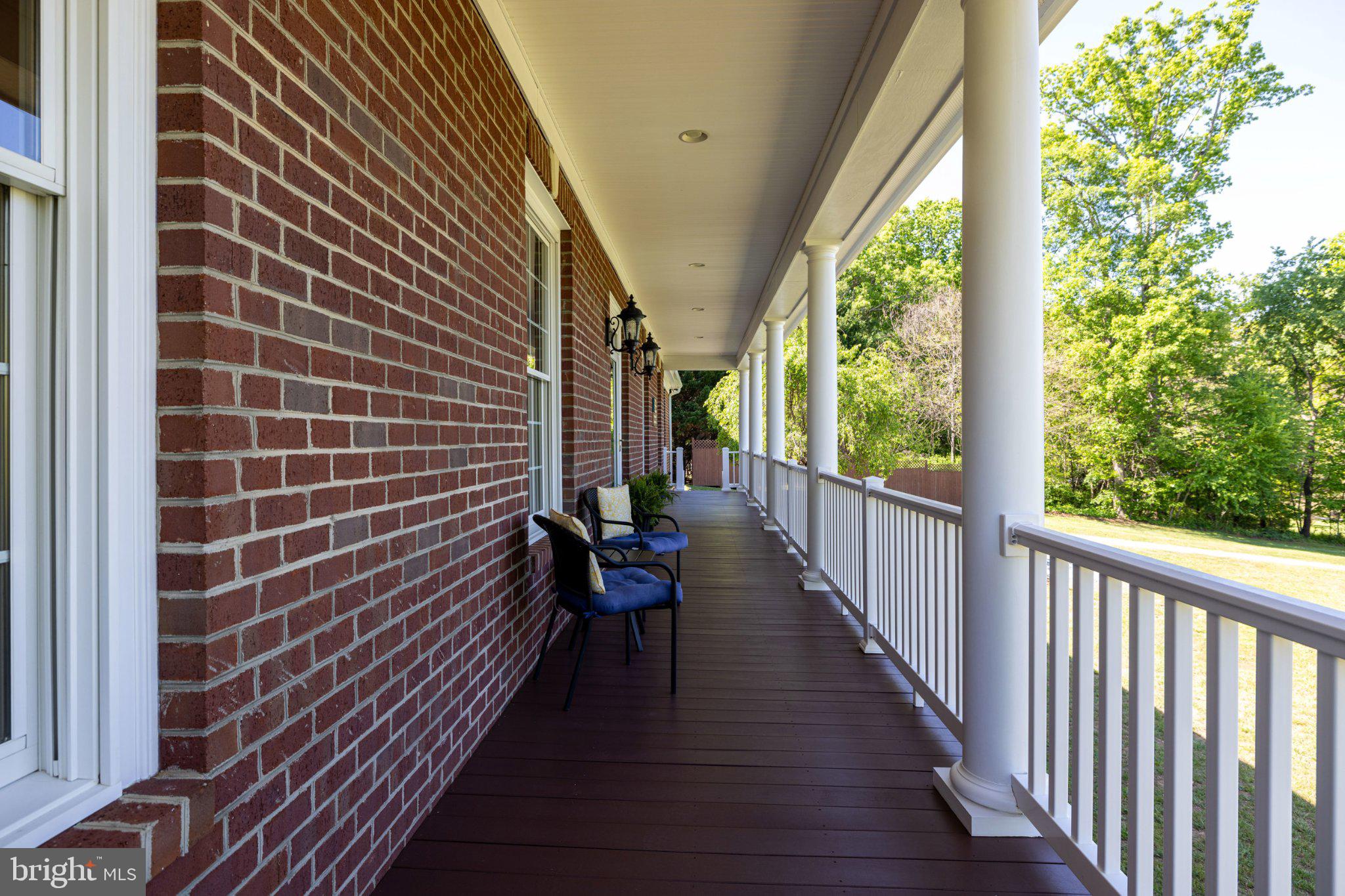 246 Lawsons Farm Circle Ruckersville, VA 22968 - Photo 75 of 130 a view of a balcony with wooden floor and fence