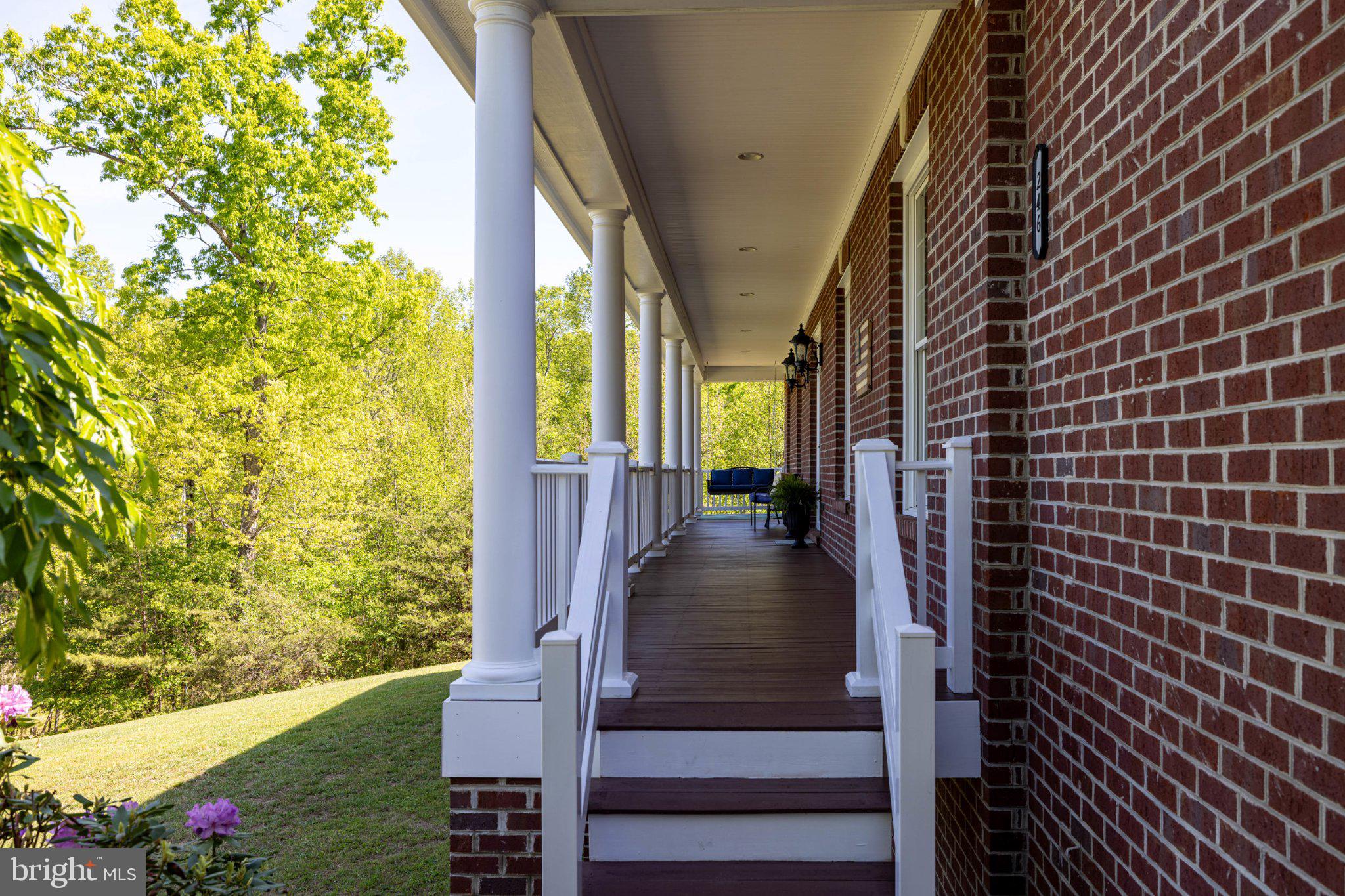 246 Lawsons Farm Circle Ruckersville, VA 22968 - Photo 76 of 130 Charming porch with lush greenery
