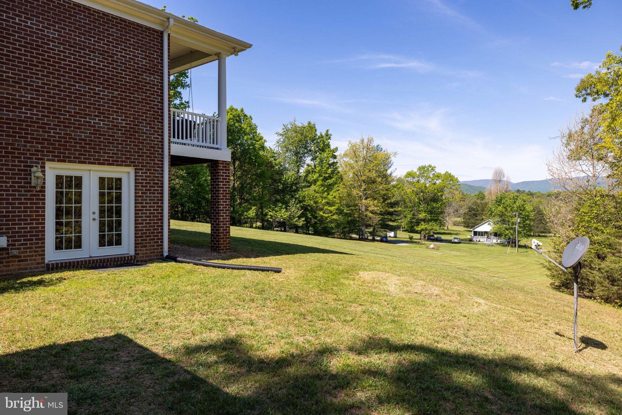246 Lawsons Farm Circle Ruckersville, VA 22968 - Photo 92 of 130 a view of a house with pool and a yard