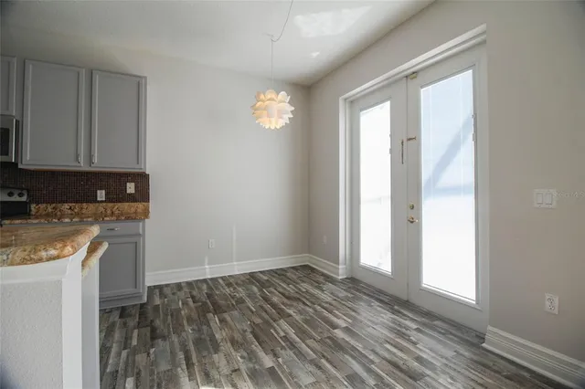 a kitchen with a sink stove and refrigerator