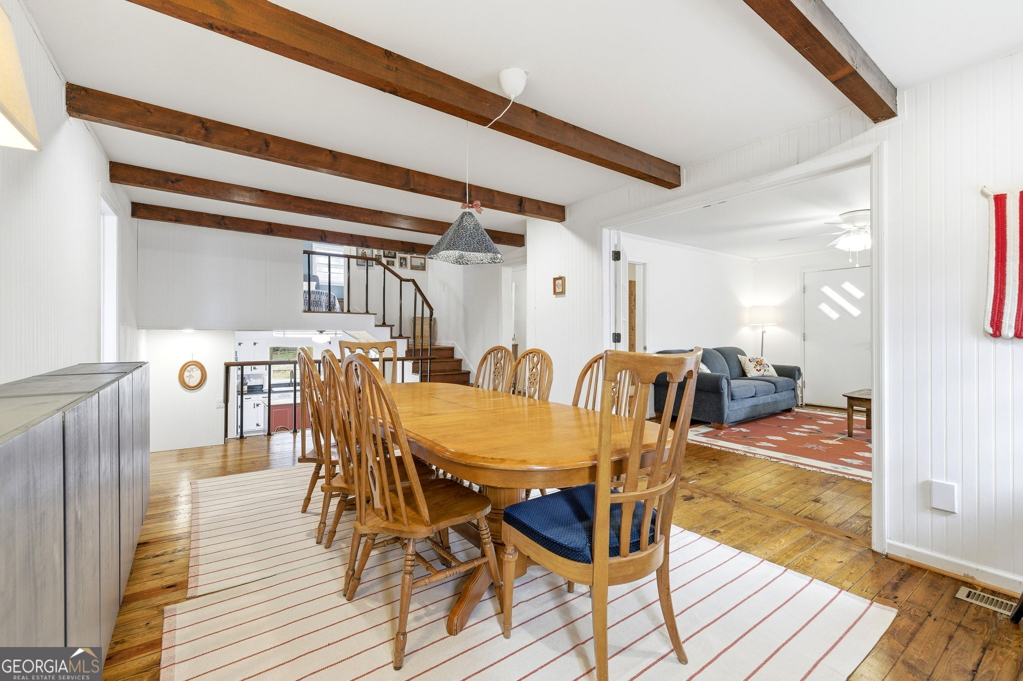 1879 Falls Road Toccoa, GA 30577 - Photo 11 of 36 a view of a dining room with furniture and wooden floor